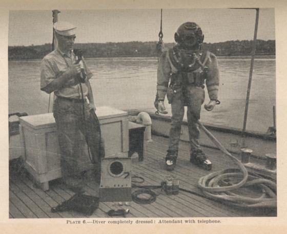 diver in dress with attendant